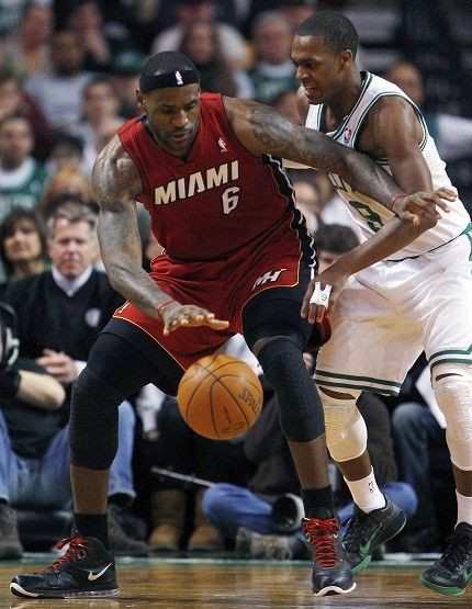 LeBron James is guarded tightly by Rajon Rondo
