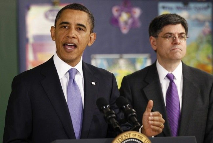 U.S. President Barack Obama speaks about the budget during his visit to Parkville Middle School and Center of Technology in Parkville, Maryland February 14, 2011. At right is OMB Director Jack Lew. 