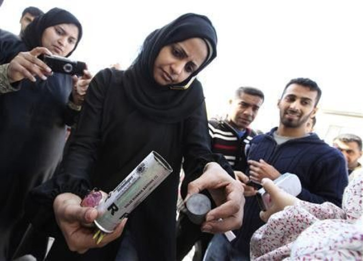 A Bahrain woman shows empty packages 