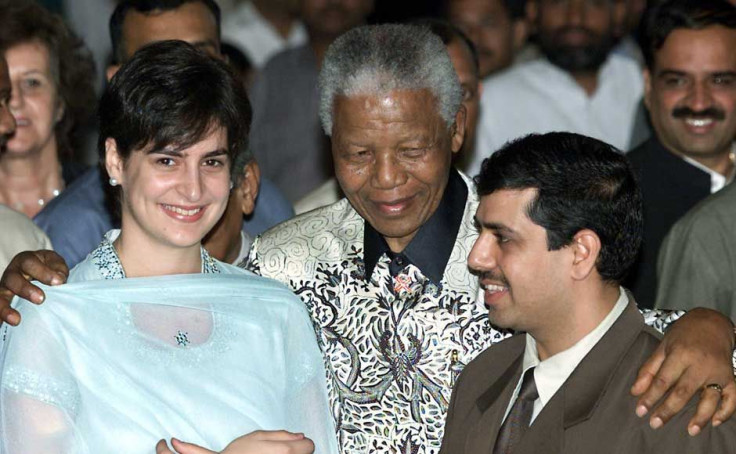 Nelson Mandela hugs Priyanka Gandhi, daughter of Congress party president Sonia Gandhi, and her husband Robert Vadra after receiving the Gandhi Peace Prize in New Delhi March 16, 2001 