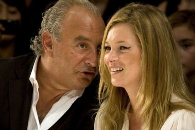 Super model Kate Moss and Top Shop owner Philip Green watch the Fashion for Relief charity fashion show in London