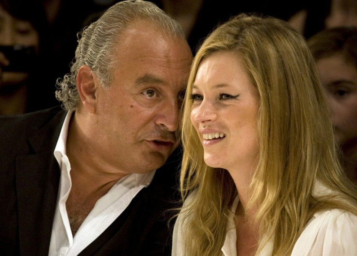 Super model Kate Moss and Top Shop owner Philip Green watch the Fashion for Relief charity fashion show in London