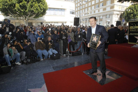 Baldwin stands on his star on the Walk of Fame in Hollywood.
