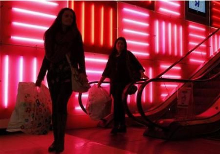 Shoppers depart with their bags at Toys R Us on Black Friday in New York