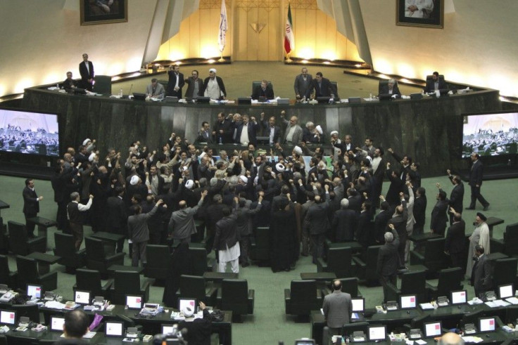 Members of the Iranian parliament shout slogans calling for the execution of opposition leaders before the start of their session in Tehran