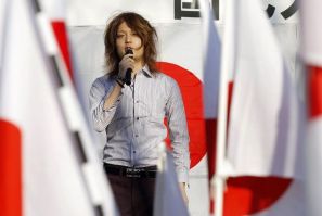 Political activist Tsunehira Furuya, 28, speaks on a podium during a rally