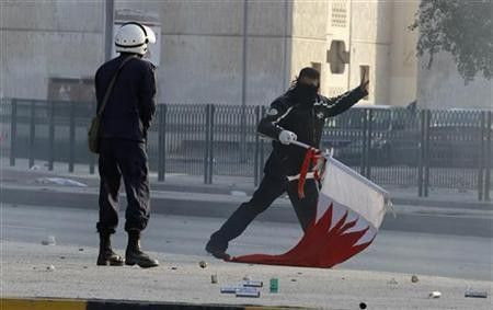 A policeman confronts a protester