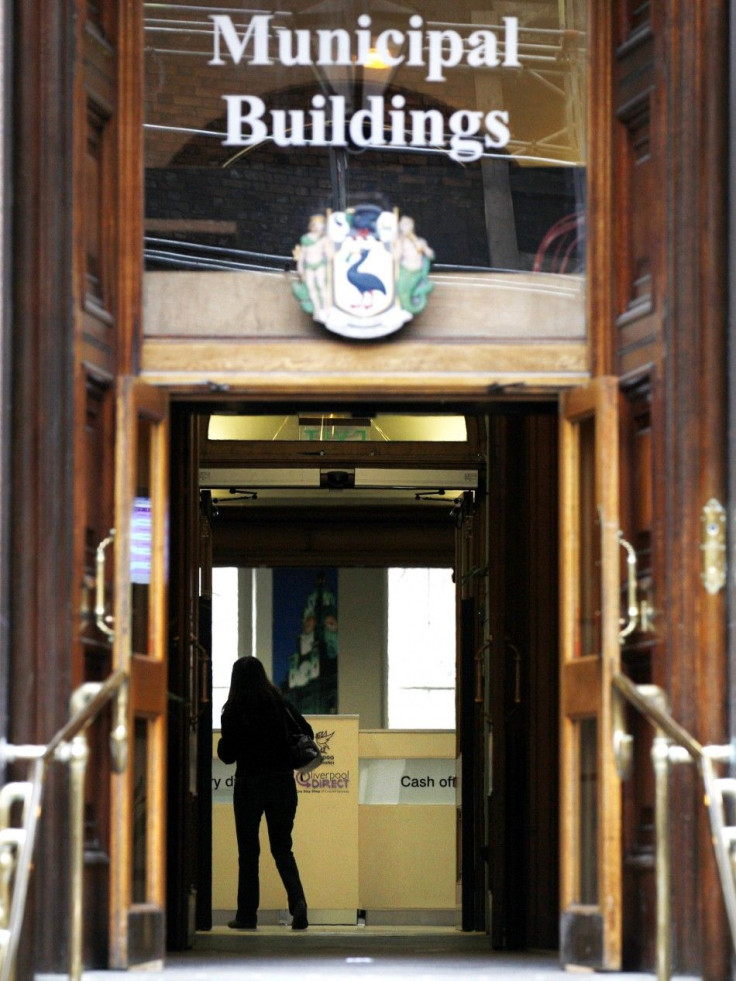 A woman walks through the foyer of Liverpool's Municipal Buildings