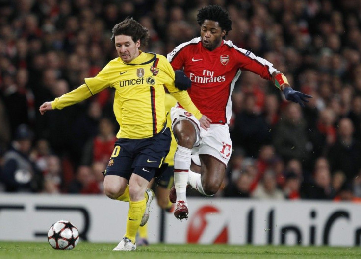 Arsenal's Song challenges Barcelona's Messi during their Champions League quarter-final soccer match in London.