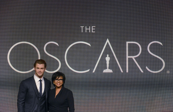 Chris Hemsworth (L) and Academy President Cheryl Boone Isaacs