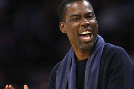 Actor Chris Rock watches New York Knicks play Los Angeles Lakers during their NBA basketball game in Los Angeles