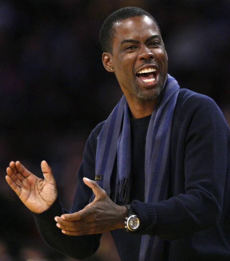 Actor Chris Rock watches New York Knicks play Los Angeles Lakers during their NBA basketball game in Los Angeles