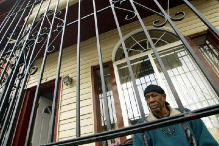 A resident sits in his enclosed porch in Camden, New Jersey.