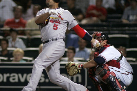 Cardinals slugger Albert Pujols hits a solo home run against the Braves during their National League MLB baseball game in Atlanta.