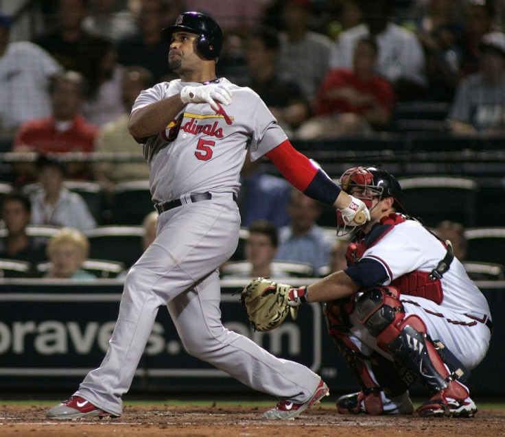 Cardinals slugger Albert Pujols hits a solo home run against the Braves during their National League MLB baseball game in Atlanta.
