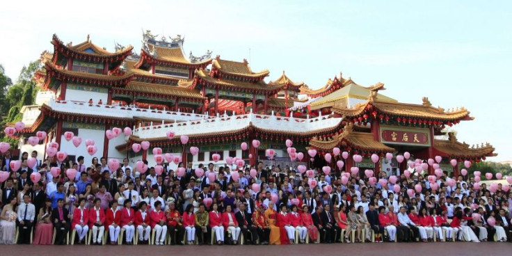 Newly-wed couples pose for pictures at Thean Hou temple in Kuala Lumpur February 14, 2014