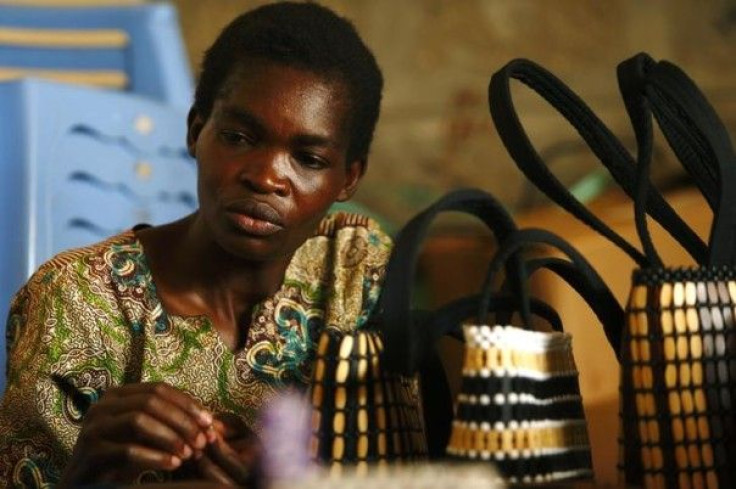 A woman makes handbags using beads at a workshop in Nairobi's Kangemi slum run by the Uzima programme for people with HIV.