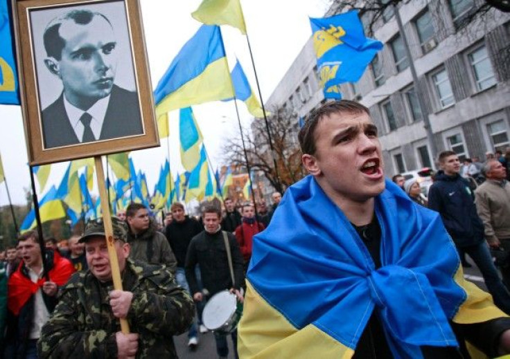 Activists of the Svoboda (Freedom) Ukrainian nationalist party shout slogans as they take part in a rally marking the 71st anniversary of the Ukrainian Insurgent Army (UPA)