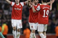 Arsenal's van Persie, Fabregas and Wilshere celebrate their victory against Barcelona after their Champions League soccer match in north London.