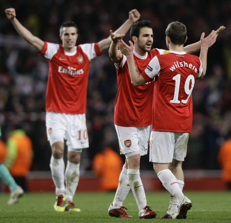 Arsenal's van Persie, Fabregas and Wilshere celebrate their victory against Barcelona after their Champions League soccer match in north London.