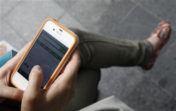 Reuters Woman Using Phone