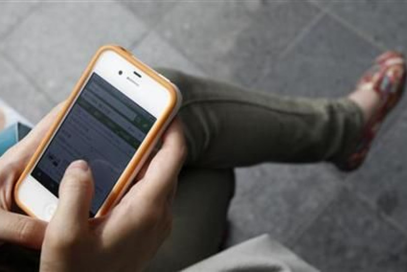 Reuters Woman Using Phone