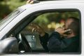 New York faces strictest law against driving with hand-held cell phones.