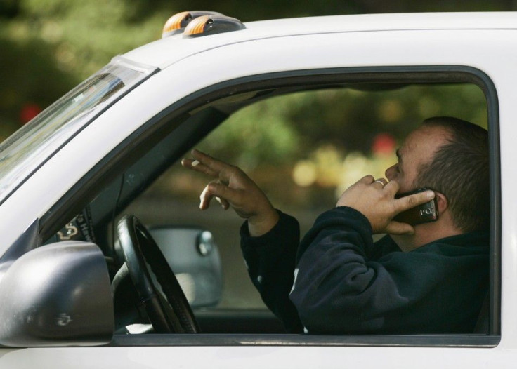 New York faces strictest law against driving with hand-held cell phones.
