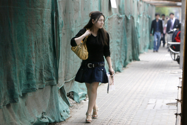 A woman wearing skirt