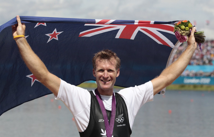 Gold medallist Mahe Drysdale holds national flag