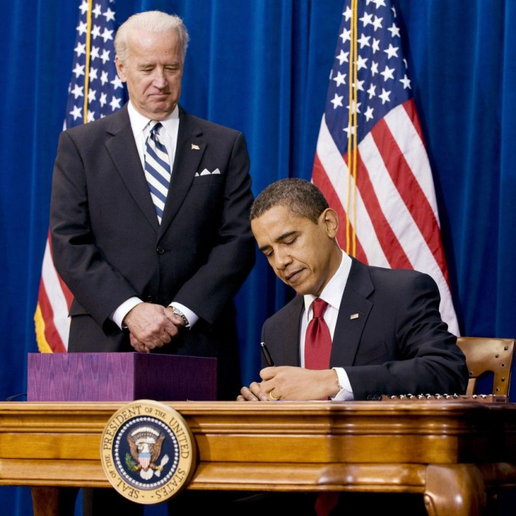 U.S. President Barack Obama signs stimulus package bill at the Denver Museum of Nature and Science