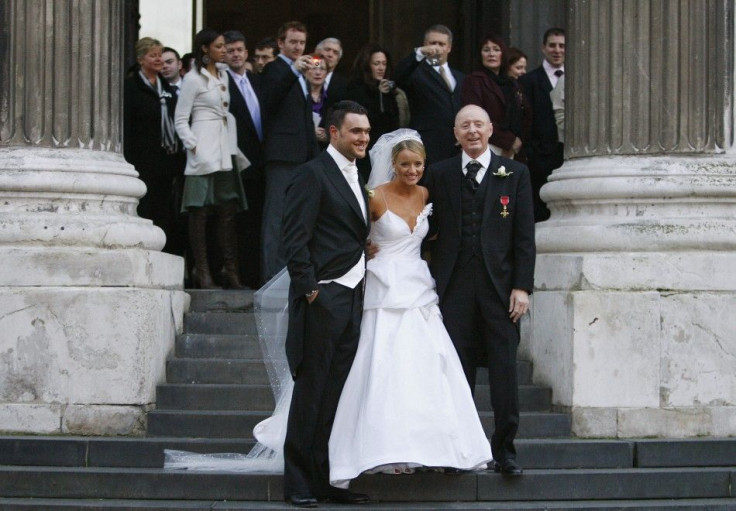 Actress Davis stands with husband Yeoman and father Carrot outside St. Paul's Cathedral after her wedding in London
