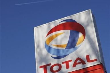 A logo for French oil giant Total SA is seen at a petrol station in London