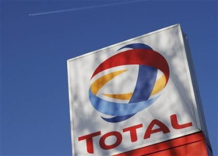 A logo for French oil giant Total SA is seen at a petrol station in London