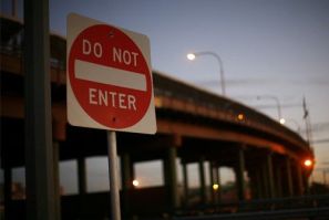 A sign is seen in front of the bridge between the United States and Mexico in El Paso, Texas November 14, 2010