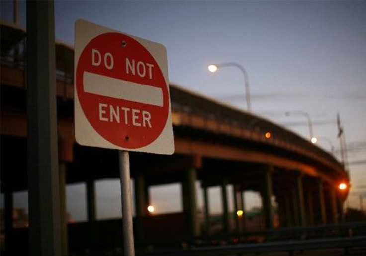 A sign is seen in front of the bridge between the United States and Mexico in El Paso, Texas November 14, 2010