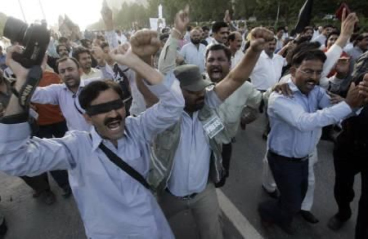 Pakistani journalists chant slogans as they march during a protest in Islamabad.