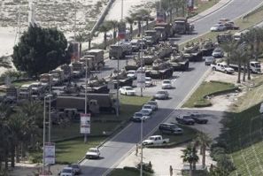 Military tanks are seen on the road to the Pearl Roundabout in Manama