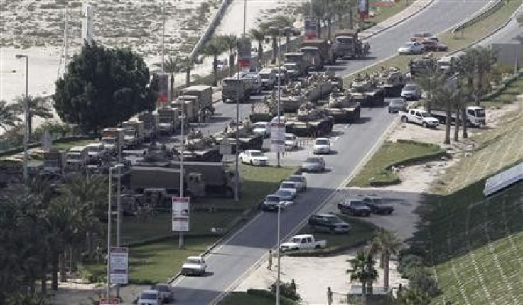 Military tanks are seen on the road to the Pearl Roundabout in Manama