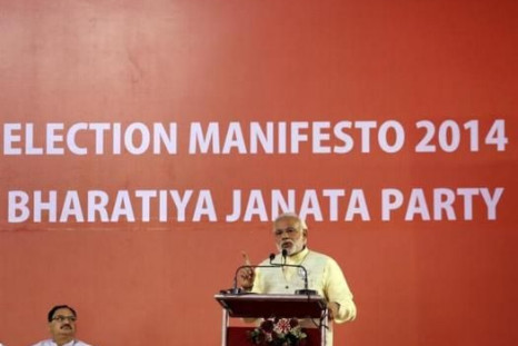 Hindu nationalist Narendra Modi, the prime ministerial candidate for Bharatiya Janata Party (BJP), addresses a gathering after releasing their election manifesto in New Delhi April 7, 2014. 