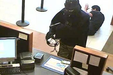 An unidentified man dressed as Darth Vader is seen robbing a Chase bank branch in Setauket.