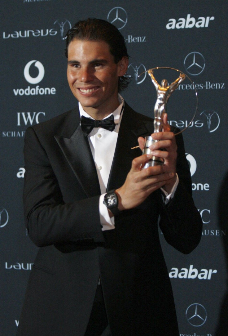 Tennis champion Nadal poses with his Laureus World Sportsman of the Year Award at Emirates Palace in Abu Dhabi.