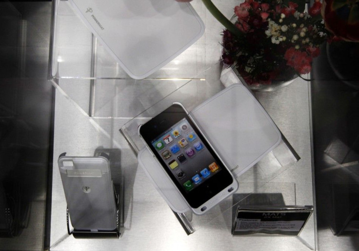 A Powermat wireless charging system is displayed as charging an Apple's iPhone 4 during the GSMA Mobile World Congress in Barcelona.