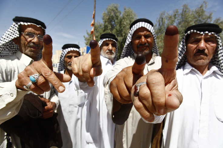 Voters Hold Up Their Fingers After Voting In The Iraqi Election