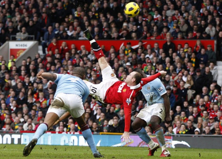 Manchester United's Wayne Rooney scores against Manchester City from an overhead kick during their English Premier League soccer match at Old Trafford in Manchester, northern England.