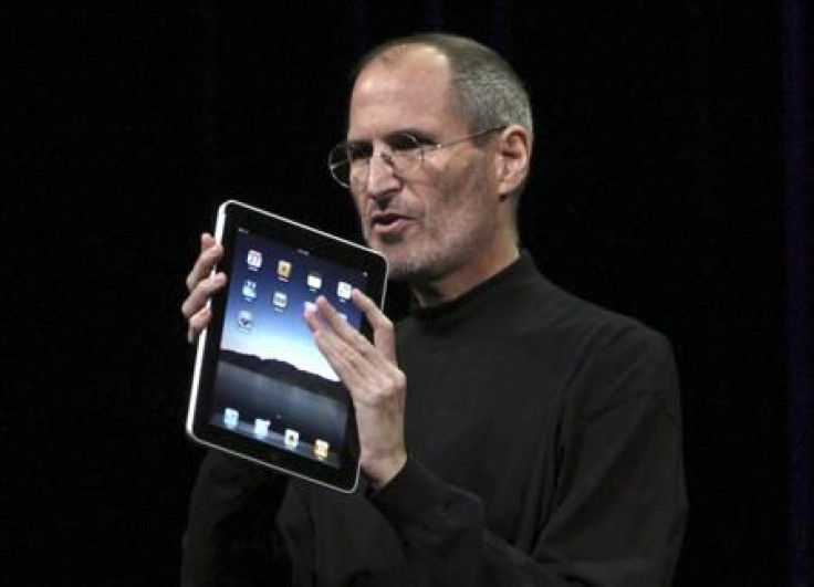 Apple CEO Steve Jobs holds the new &quot; iPad&quot; during the launch of Apple&#039;s new tablet computing device in San Francisco