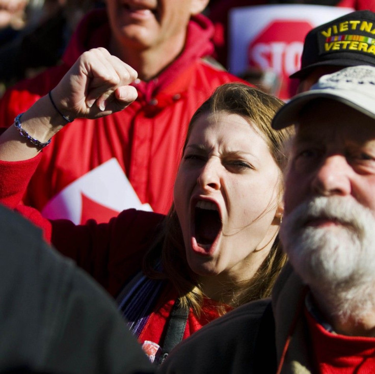 Protestors crowd the State Capitol grounds as members of the Wisconsin state government discuss the proposed bill by Republican Governor Walker in Madison