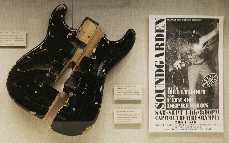 Fragments of a Fender Stratocaster electric guitar that was smashed to pieces in 1992 by singer Kurt Cobain is pictured at the Grammy Museum in Los Angeles, California during a media preview December 2, 2008