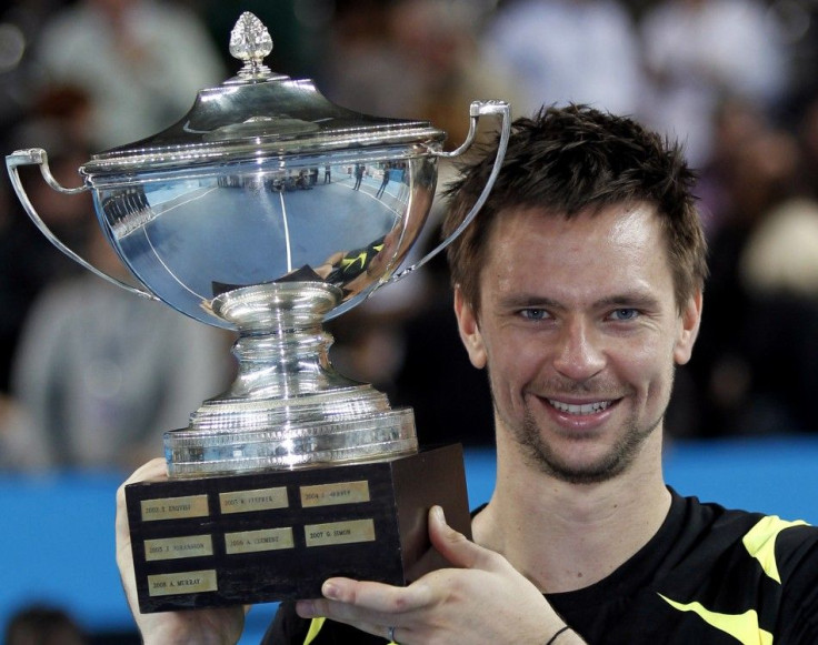 Soderling of Sweden holds his trophy after winning against Cilic of Croatia at their men's final match at the Marseille Open tennis tournament.