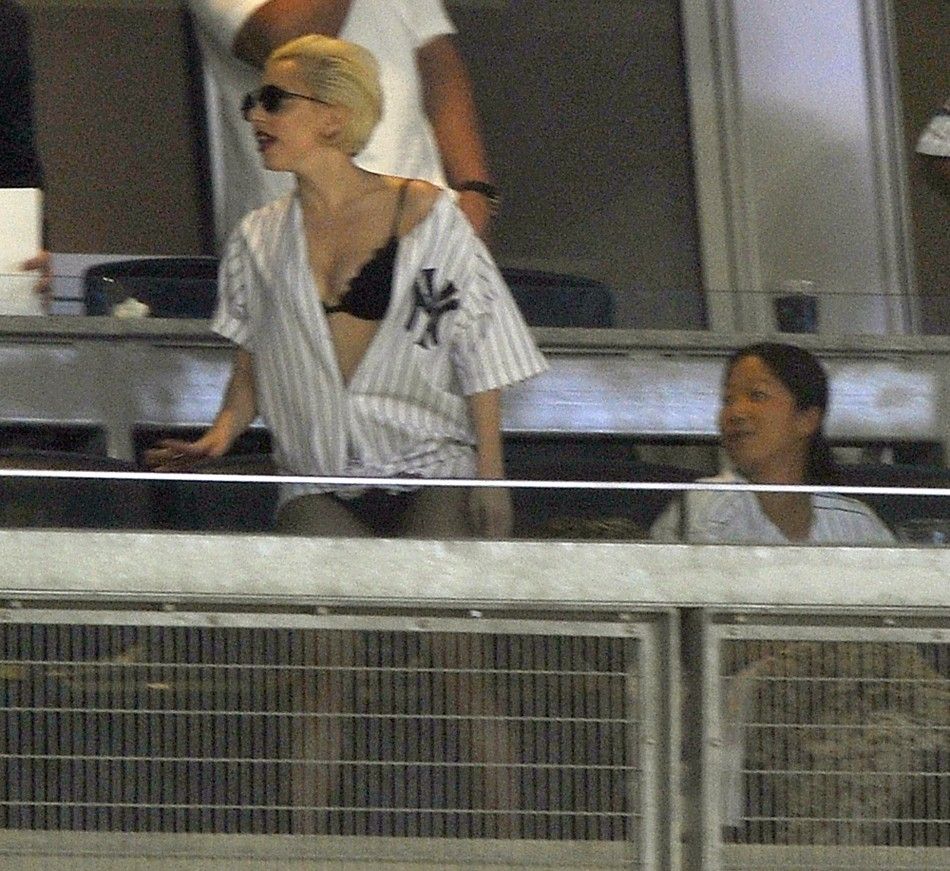 Singer Lady Gaga watches the New York Yankees play the New York Mets in the fourth inning of their MLB inter-league baseball game at Yankee Stadium in New York, June 18, 2010. 